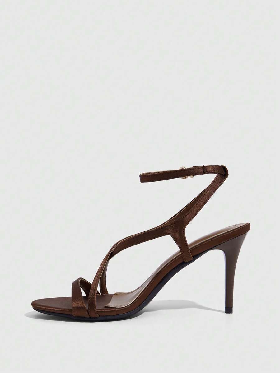 Square toe stiletto high heel sandals in deep burgundy satin featuring criss cross straps and an open toe design.