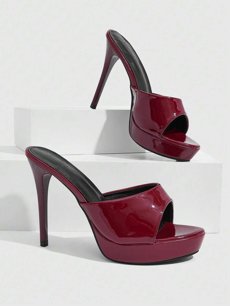 Women's open-toe round toe stiletto high heel sandals featuring a sleek slingback strap and elegant mid-heel design.