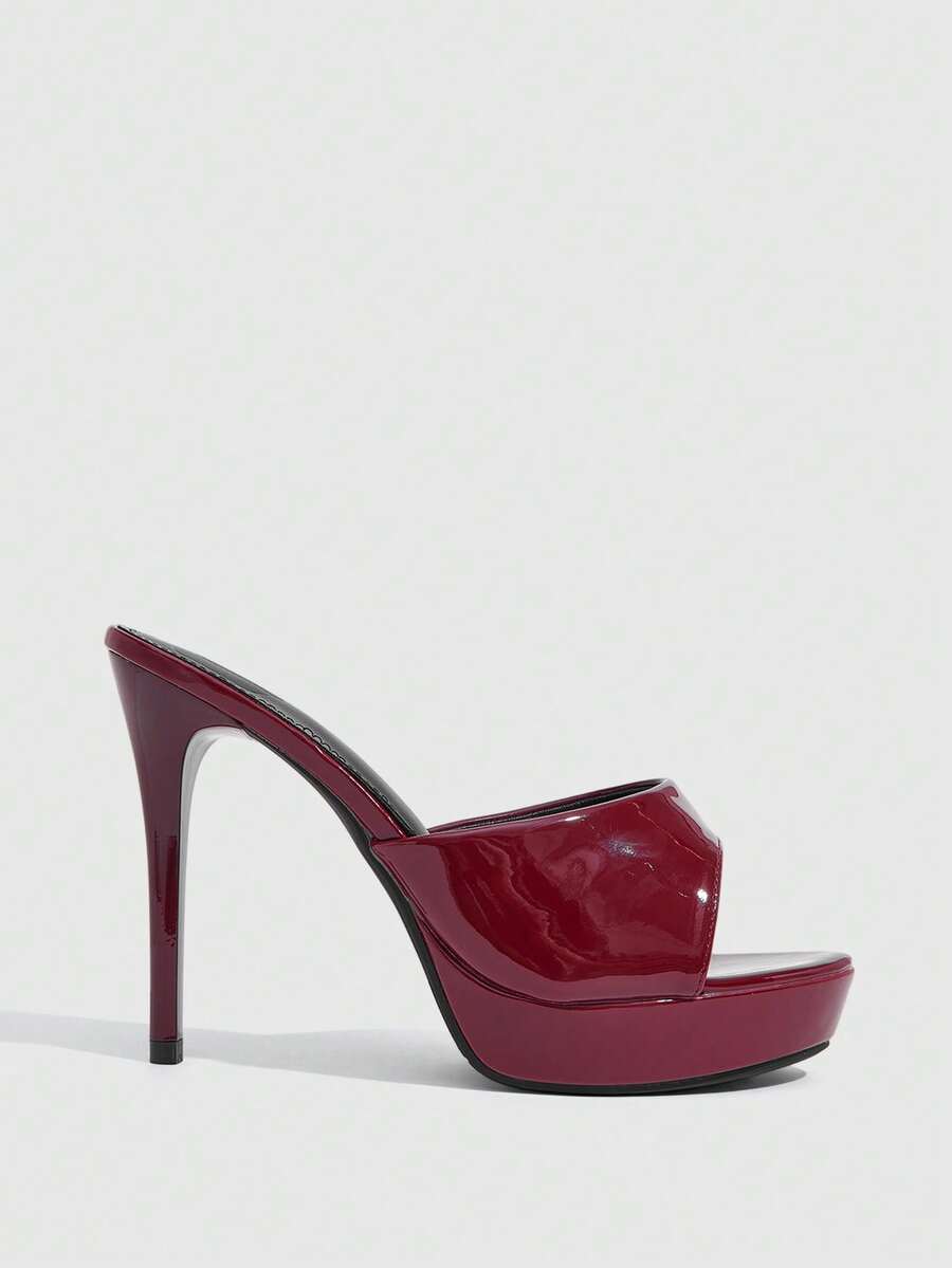 Women's open-toe round toe stiletto high heel sandals featuring a sleek slingback strap and elegant mid-heel design.