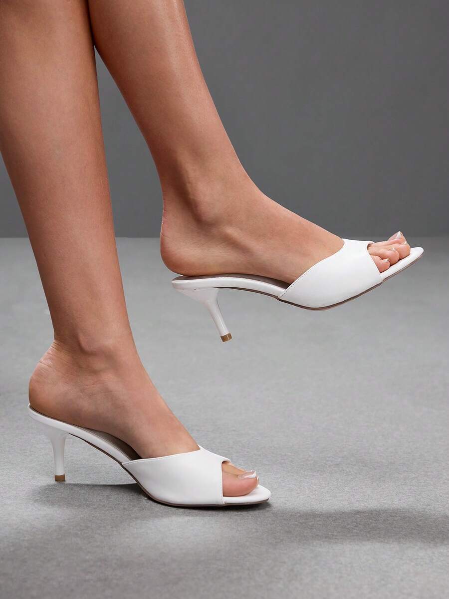 Pair of women's open toe high heel slingback sandals made with smooth PU leather