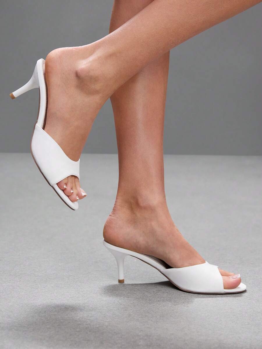 Pair of women's open toe high heel slingback sandals made with smooth PU leather