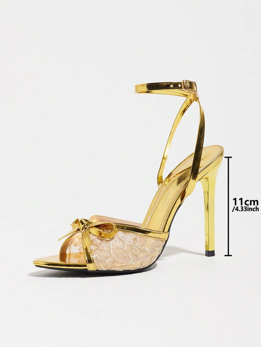 Burgundy open-toe high heels featuring an adjustable ankle strap with buckle closure and high stiletto heel.