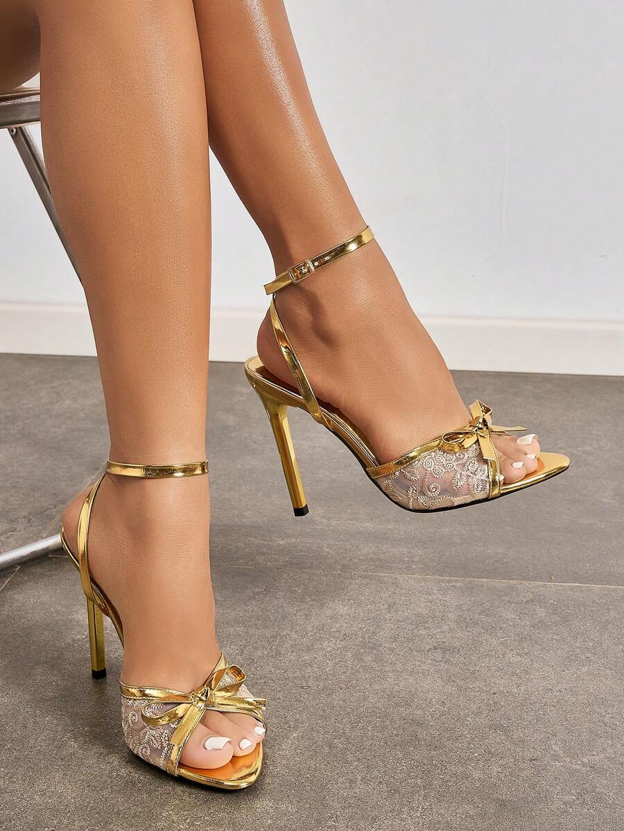 Burgundy open-toe high heels featuring an adjustable ankle strap with buckle closure and high stiletto heel.