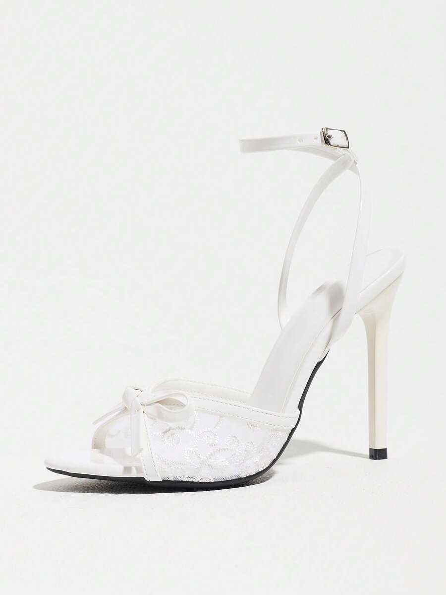 Burgundy open-toe high heels featuring an adjustable ankle strap with buckle closure and high stiletto heel.