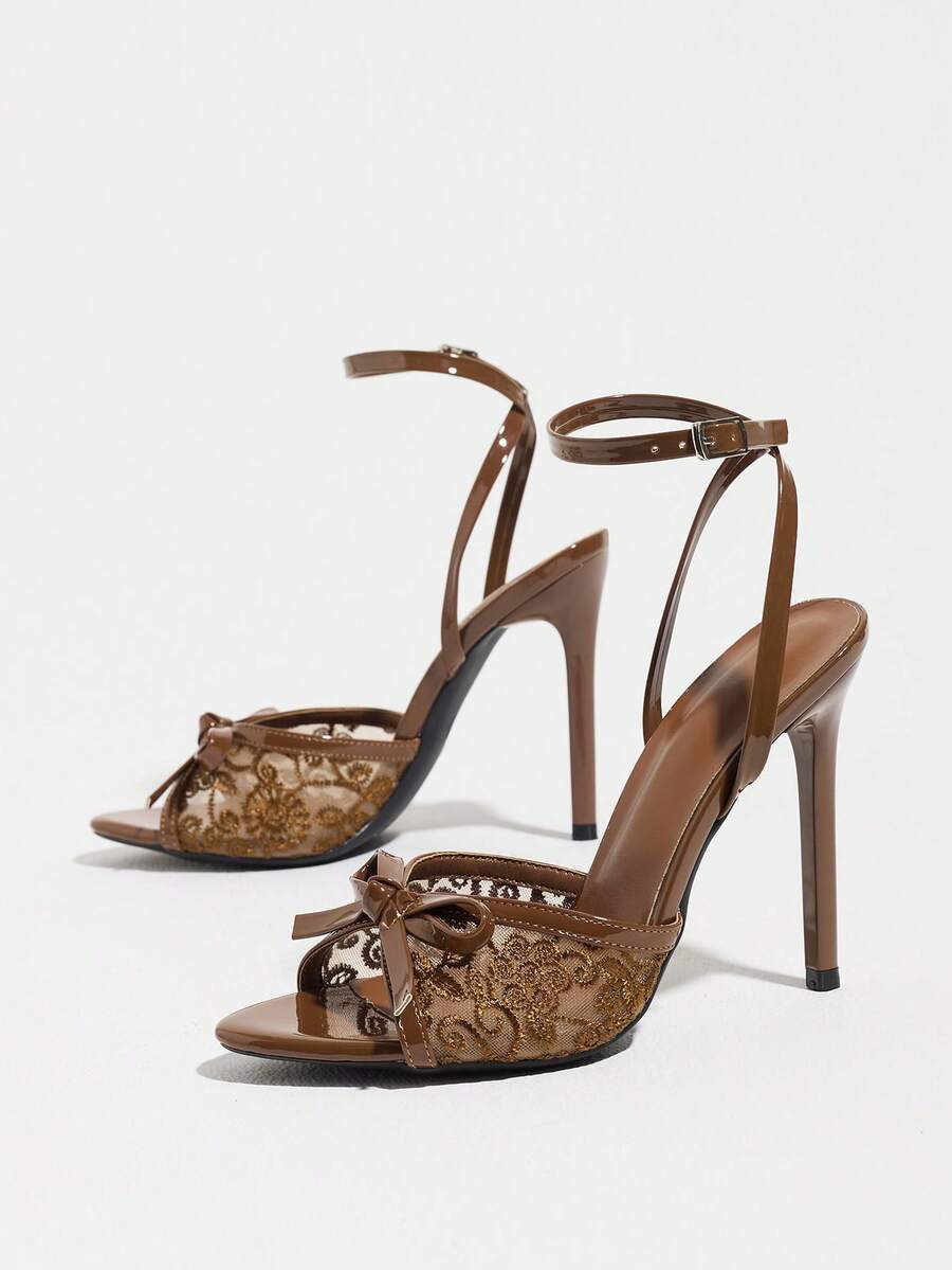 Burgundy open-toe high heels featuring an adjustable ankle strap with buckle closure and high stiletto heel.