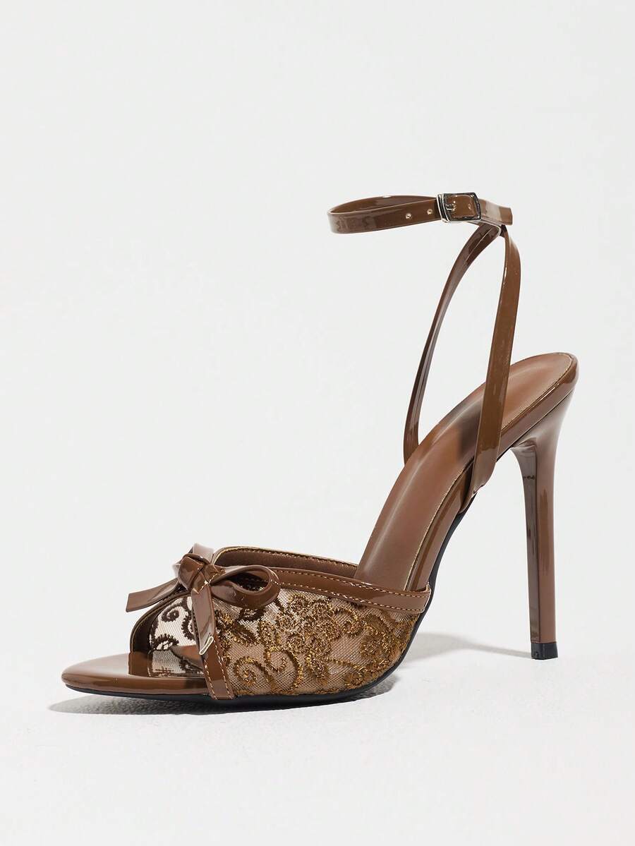 Burgundy open-toe high heels featuring an adjustable ankle strap with buckle closure and high stiletto heel.
