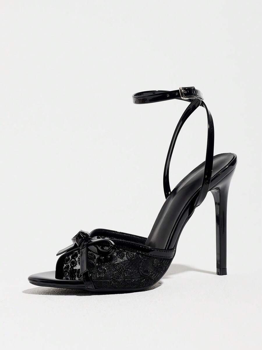 Burgundy open-toe high heels featuring an adjustable ankle strap with buckle closure and high stiletto heel.