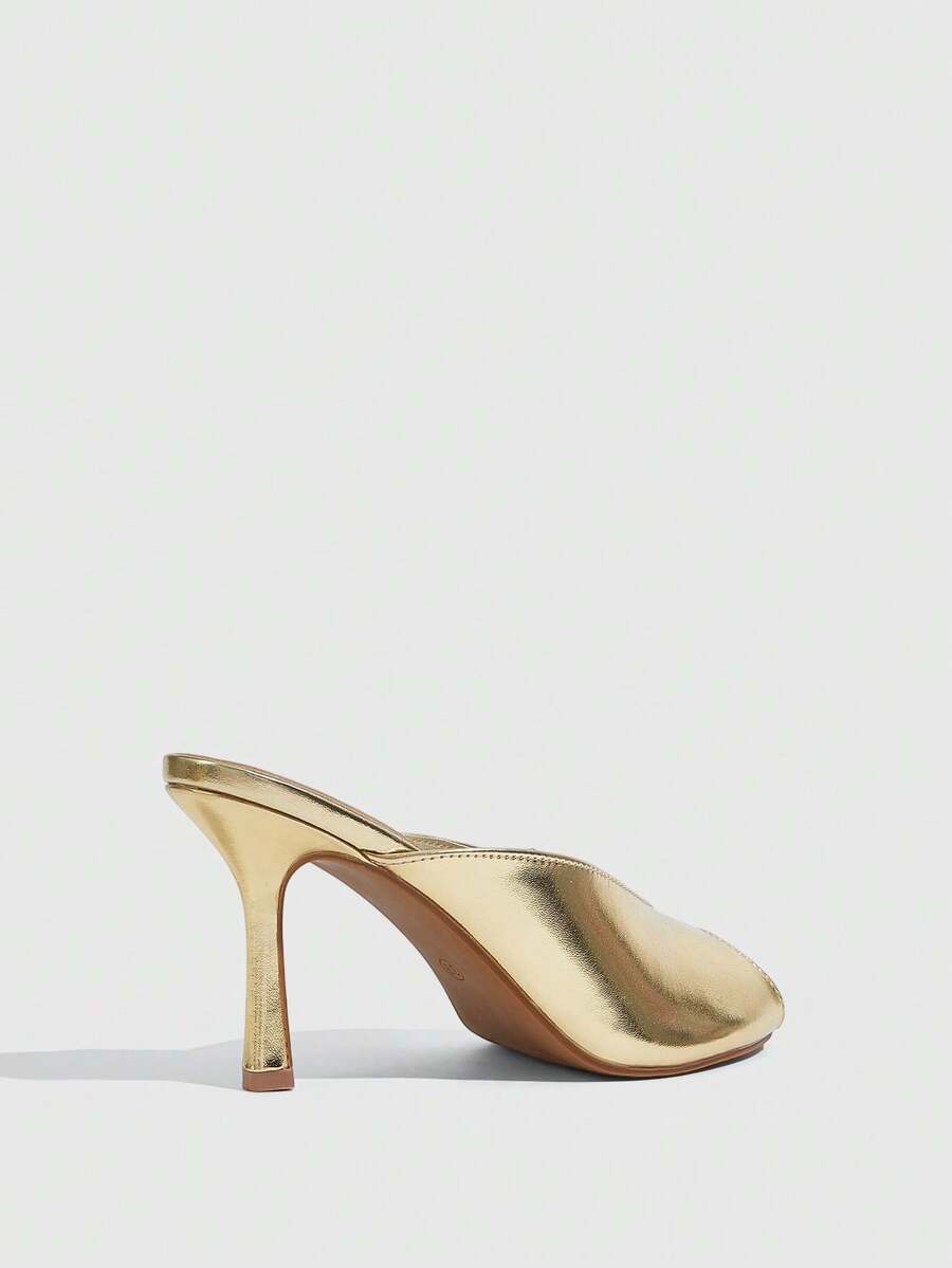 Women's pointed peep toe high heel stilettos featuring cross ankle strap with buckle in black PU leather.