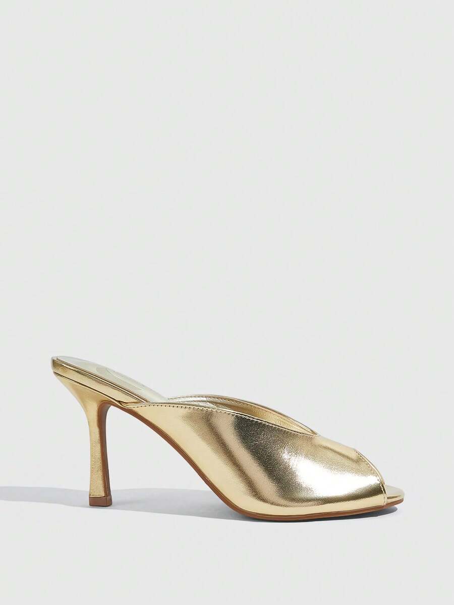 Women's pointed peep toe high heel stilettos featuring cross ankle strap with buckle in black PU leather.