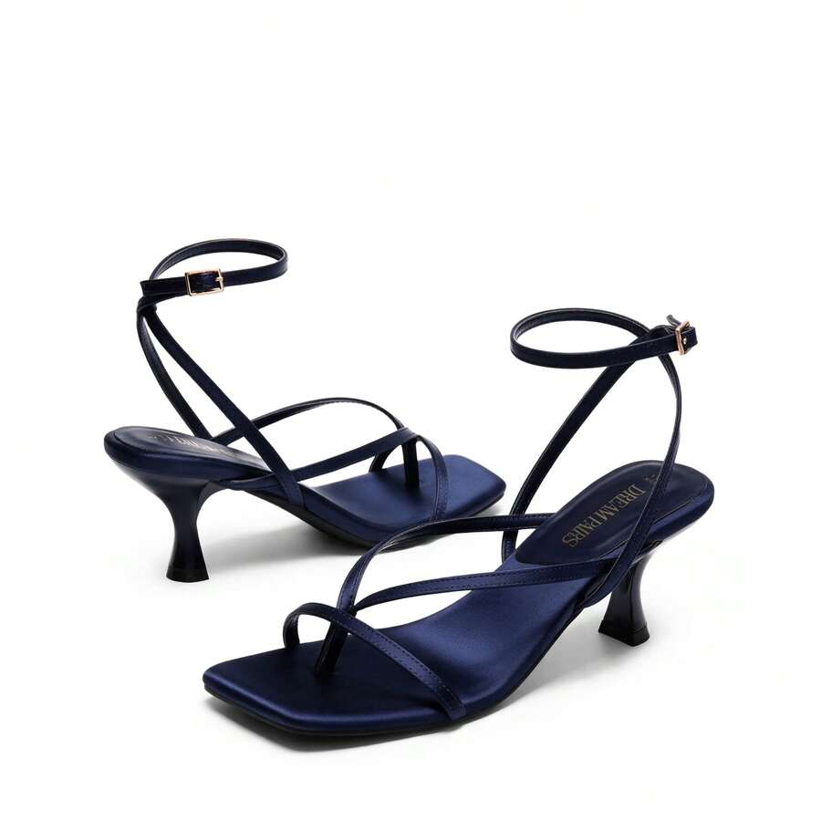 Pair of women's minimalist square toe kitten heeled thong sandals featuring slim ankle straps with buckle closure and sleek low heels.