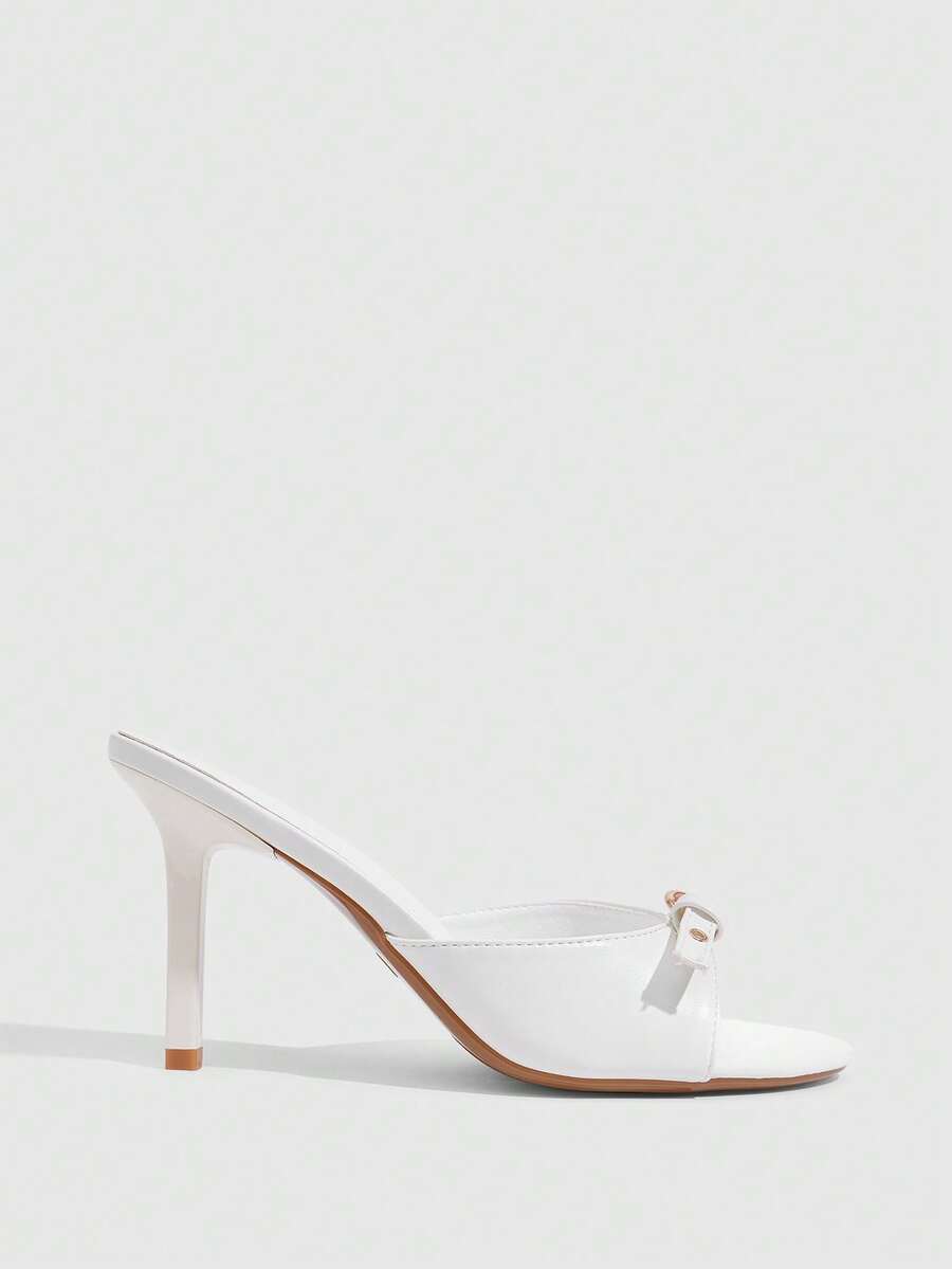 Elegant burgundy high heel slingback sandals with an open toe and round buckle strap.