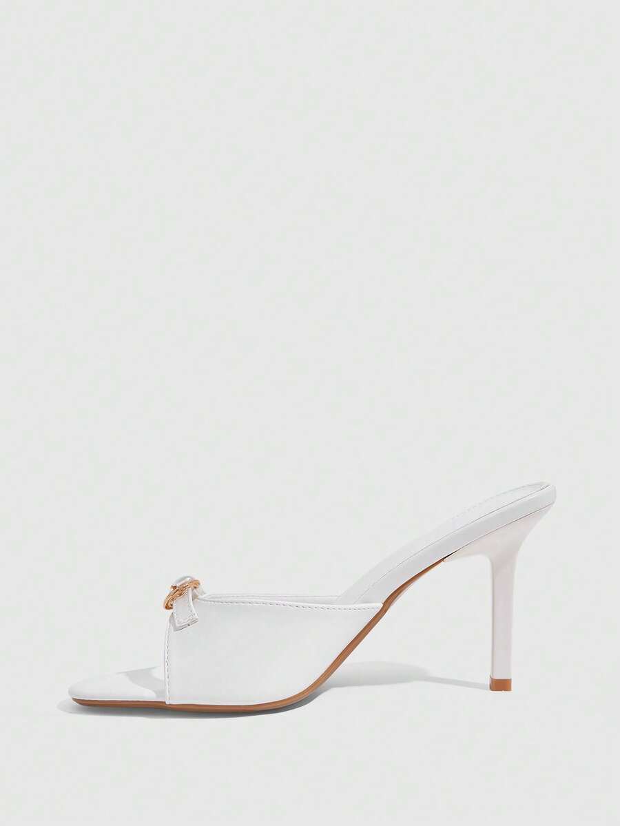 Elegant burgundy high heel slingback sandals with an open toe and round buckle strap.