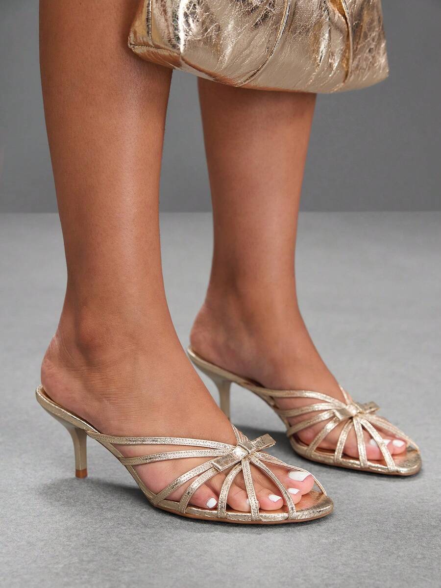 Women's brown flannel pointed open-toe heeled sandals featuring a slip-on mule design with high stiletto heels.