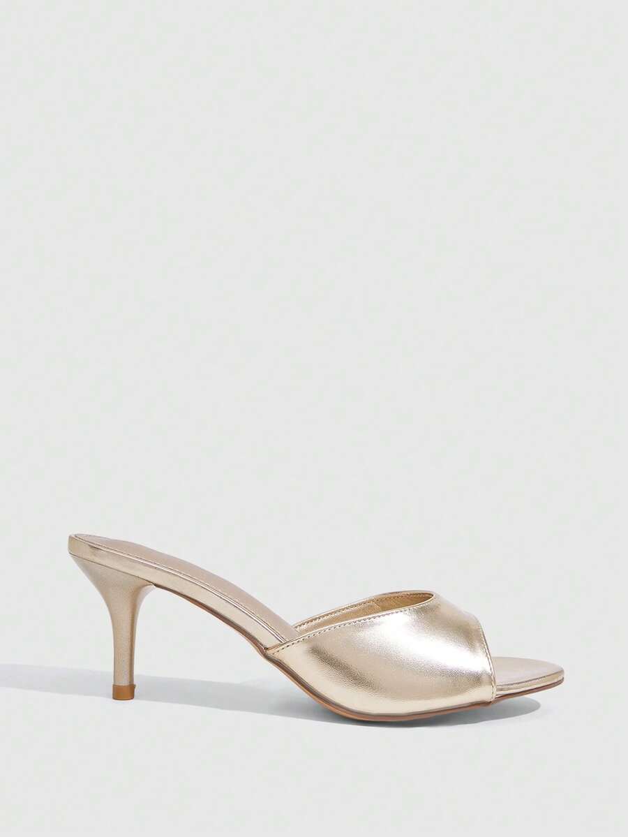 Pair of women's open toe high heel slingback sandals made with smooth PU leather