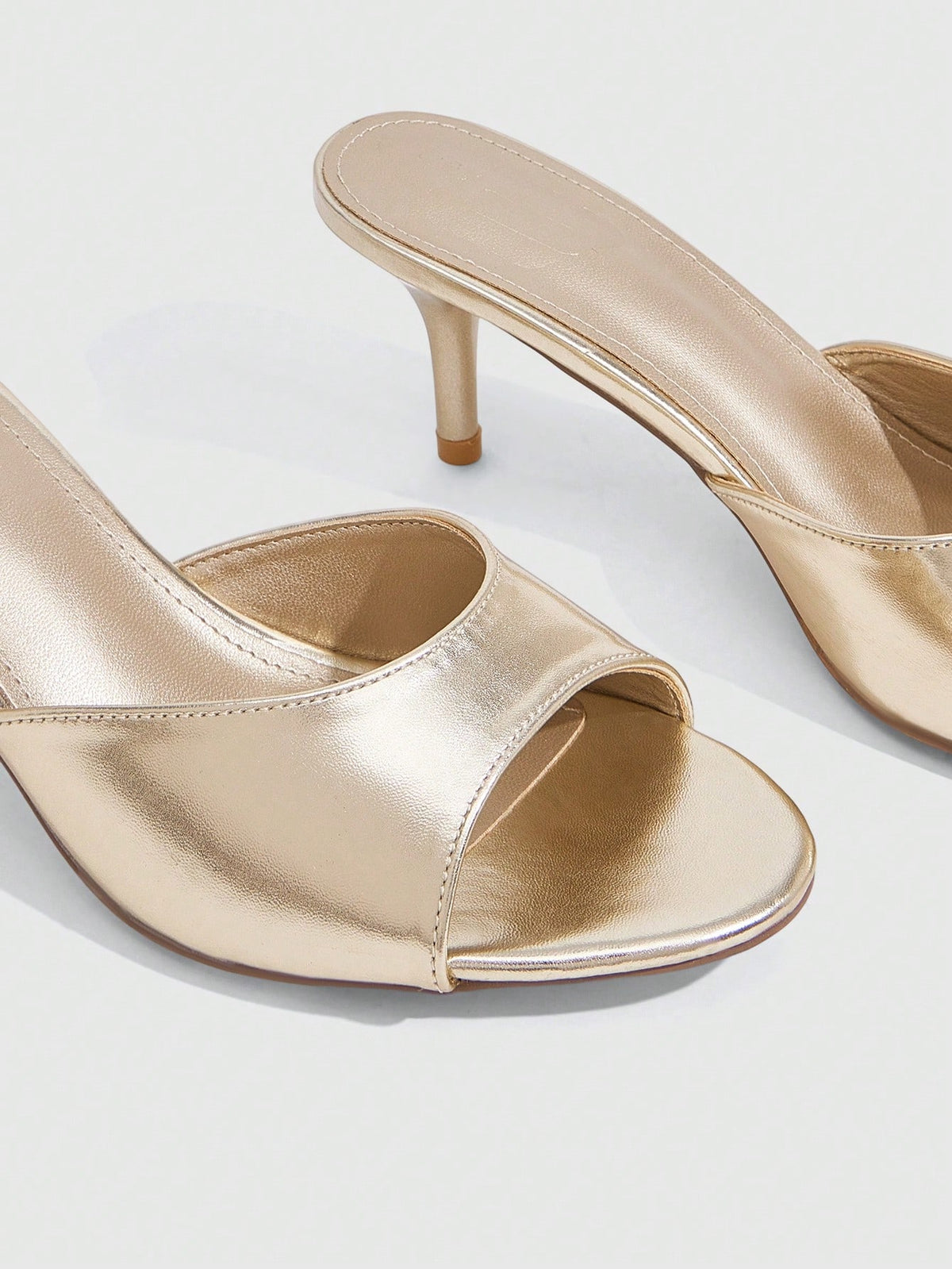 Pair of women's open toe high heel slingback sandals made with smooth PU leather