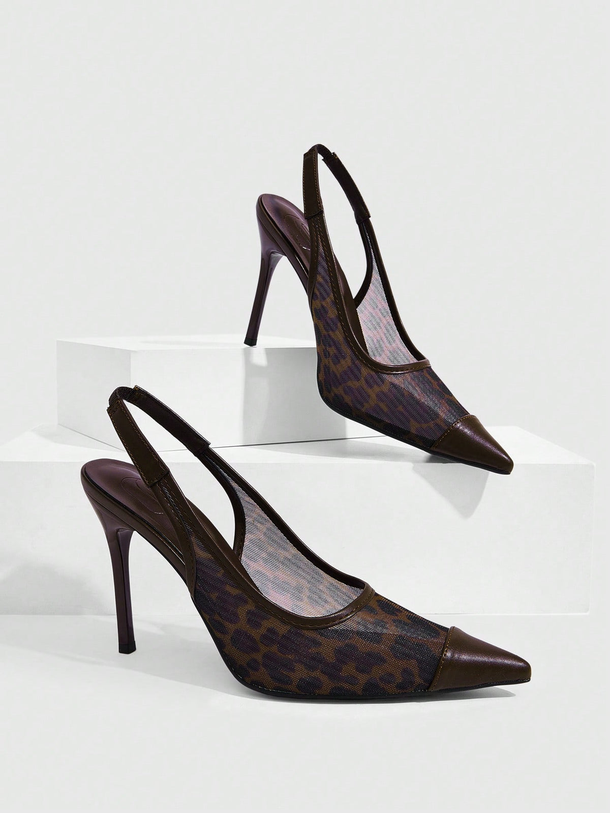 Women's pointed toe high heel shoes featuring breathable mesh detailing, stiletto heel, and adjustable ankle strap with buckle closure.