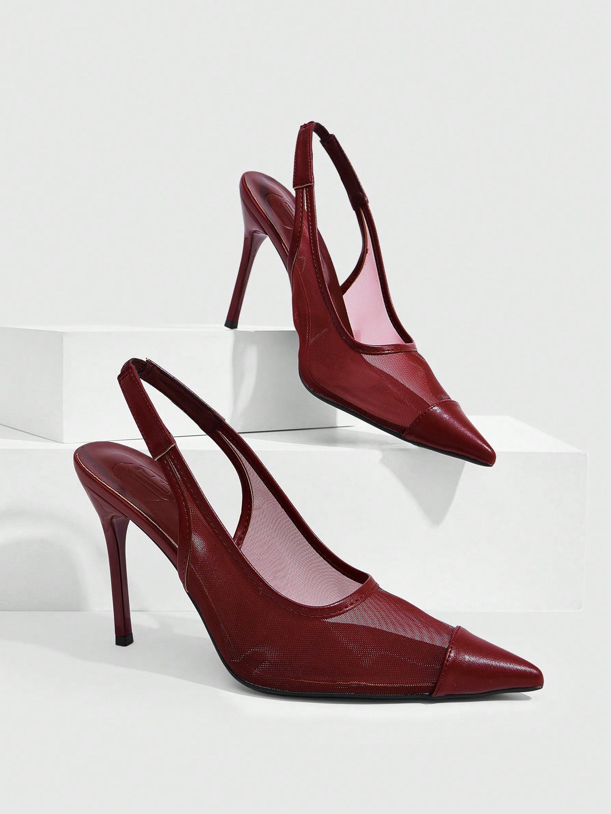 Women's pointed toe high heel shoes featuring breathable mesh detailing, stiletto heel, and adjustable ankle strap with buckle closure.