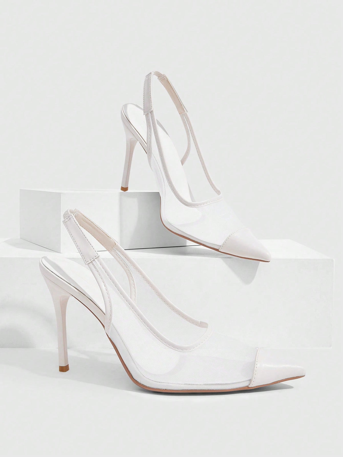 Women's pointed toe high heel shoes featuring breathable mesh detailing, stiletto heel, and adjustable ankle strap with buckle closure.