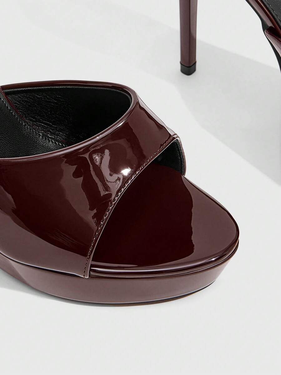 Women's open-toe round toe stiletto high heel sandals featuring a sleek slingback strap and elegant mid-heel design.