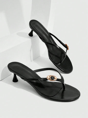 Women's slingback heeled sandals featuring a button toe post accent, sleek mid pyramid heel, and smooth faux leather finish.