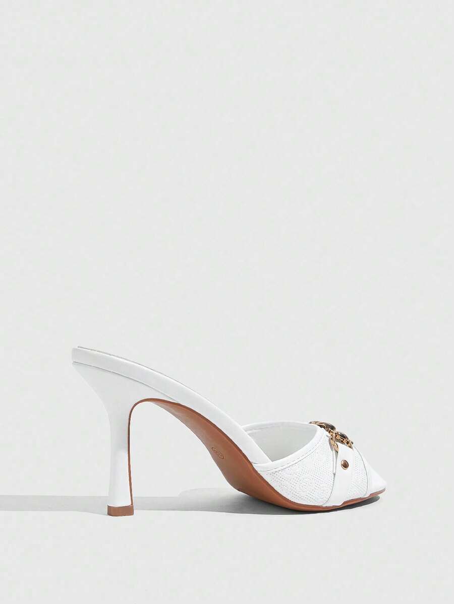 Women's beige high heel mule sandals with open round toe and metal chain detail