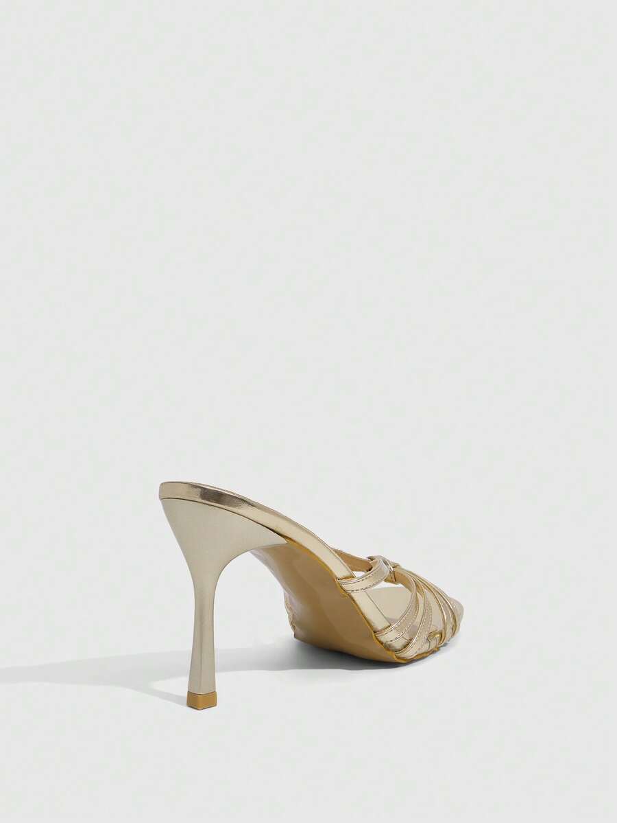Women's champagne stiletto high heel sandals featuring knotted cross-over straps, open round toe, and adjustable ankle buckle strap.