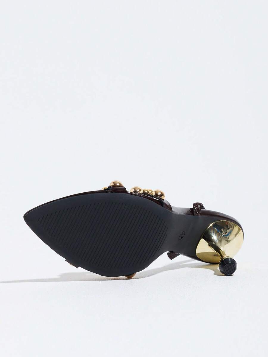 Pointed toe party high heels in gold featuring wavy lace trim, a stiletto heel, and back tie slingback straps.
