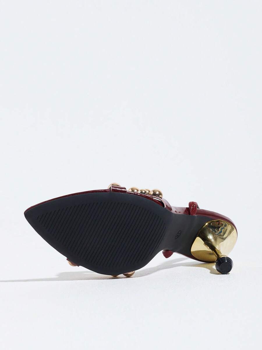 Pointed toe party high heels in gold featuring wavy lace trim, a stiletto heel, and back tie slingback straps.