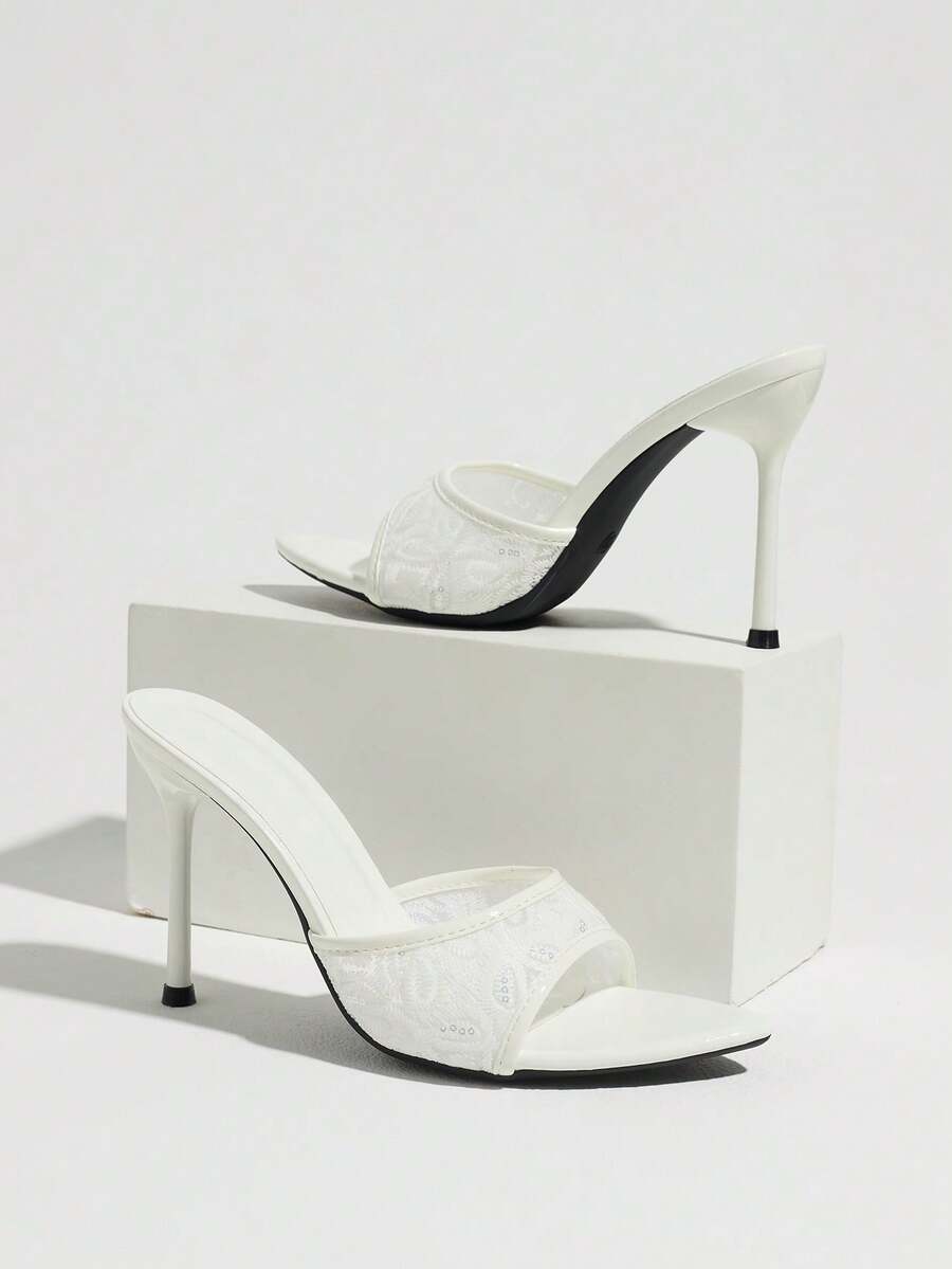 Women's open toe stiletto high heel mule shoes in smooth PU leather with slip-on strap design.