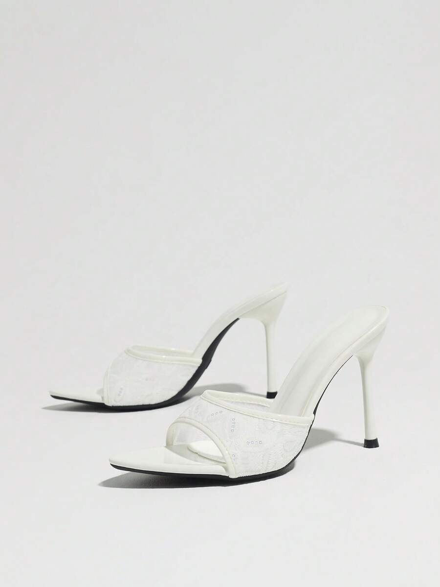 Women's open toe stiletto high heel mule shoes in smooth PU leather with slip-on strap design.