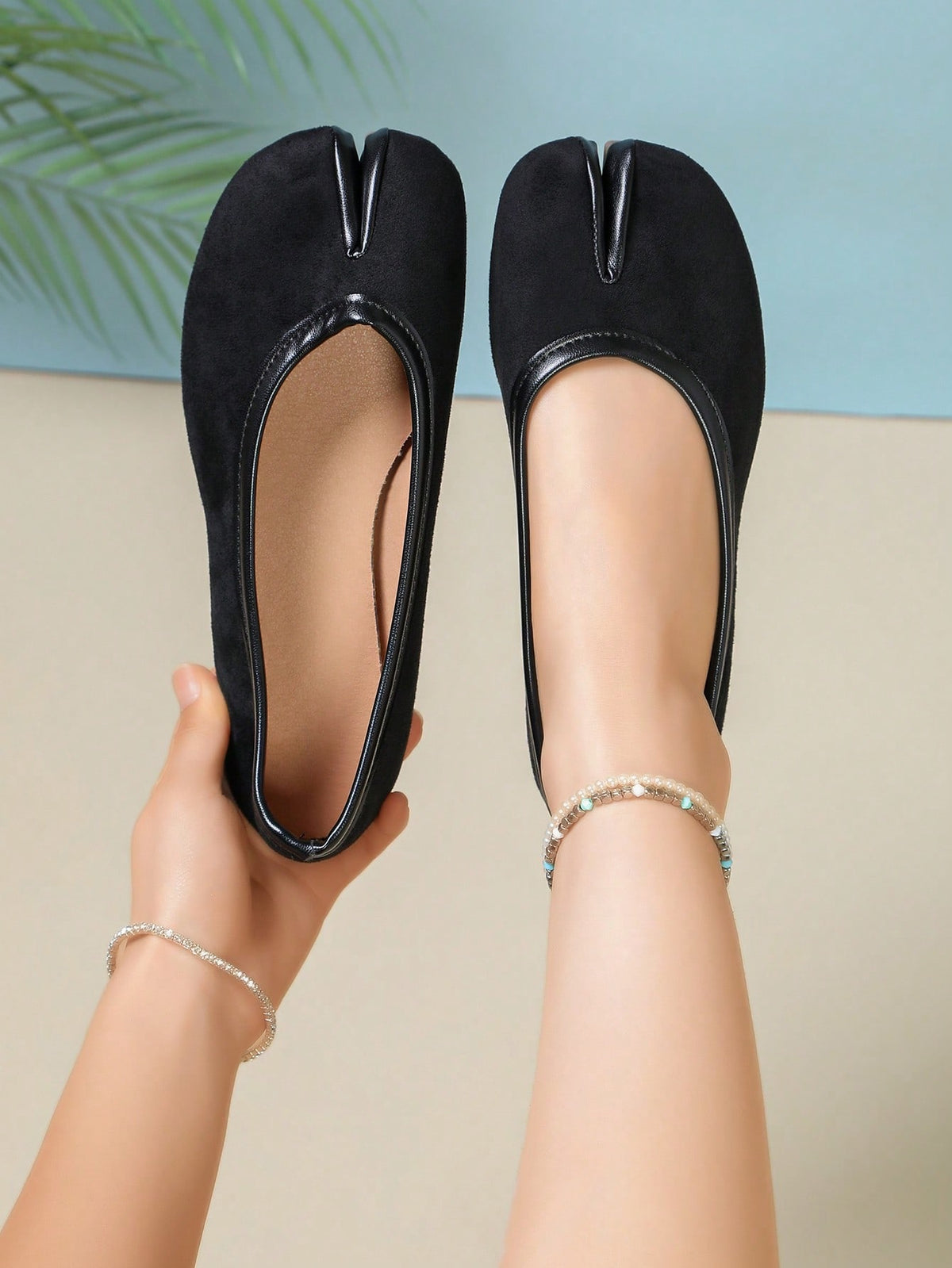 Women's white split-toe slip-on flat shoes with braided accent and rubber sole