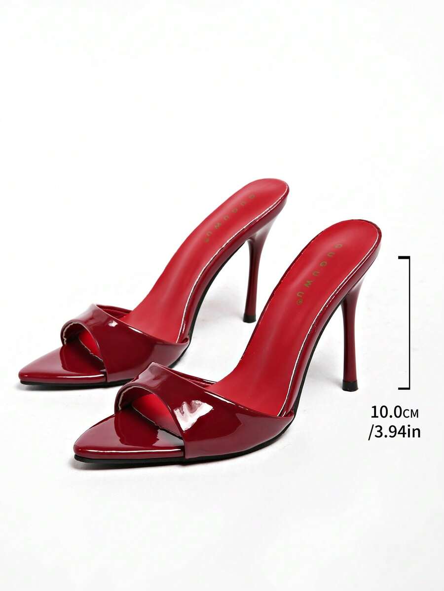 Patent leather open toe slingback slide sandals with stiletto high heels and slip on design.