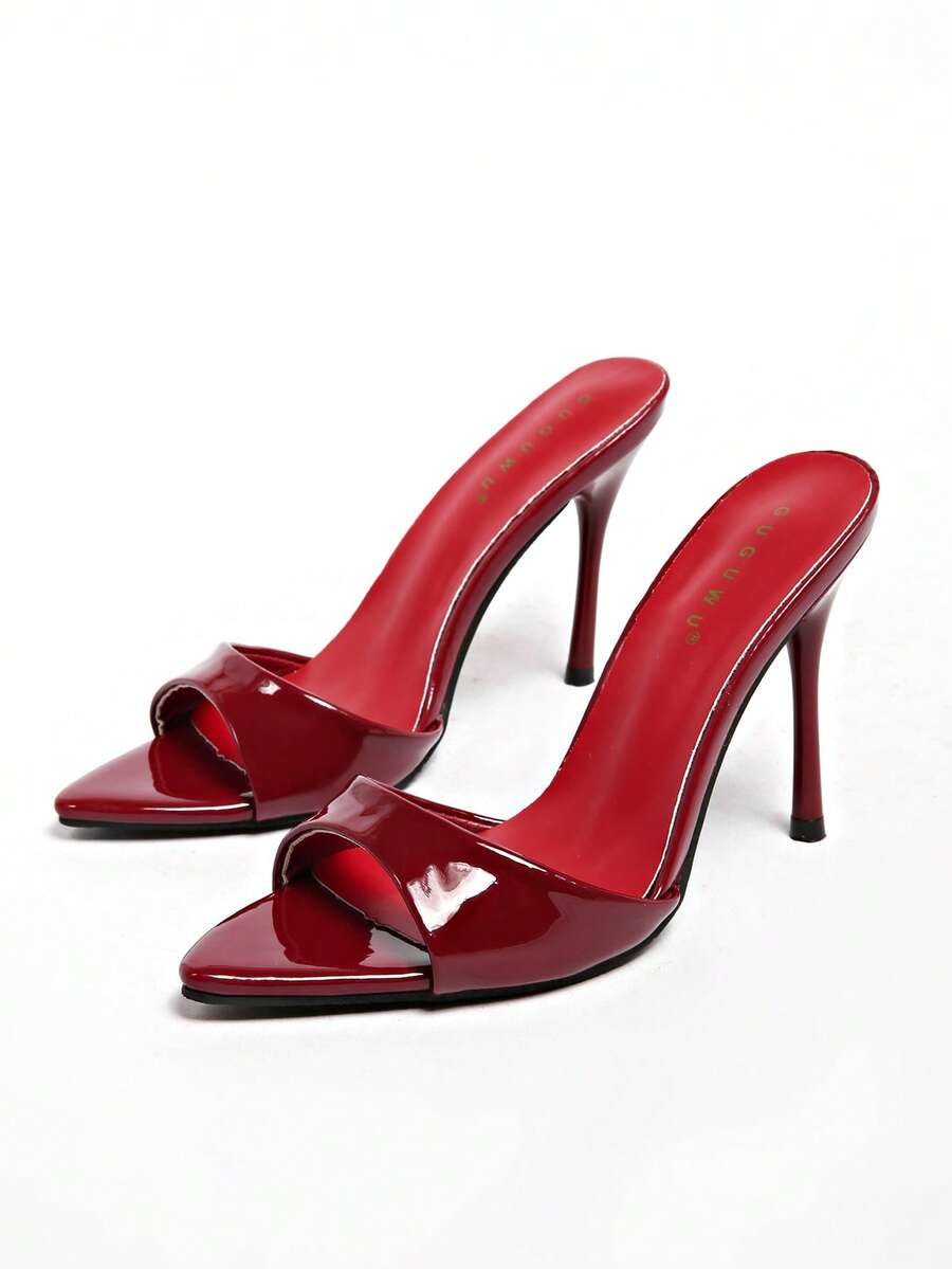 Patent leather open toe slingback slide sandals with stiletto high heels and slip on design.