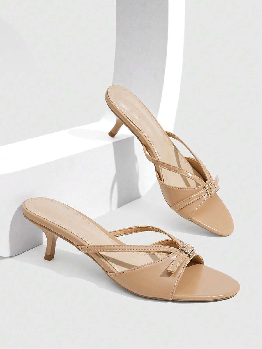 Women's light gold kitten heel slingback sandals featuring an open toe and round buckle strap.