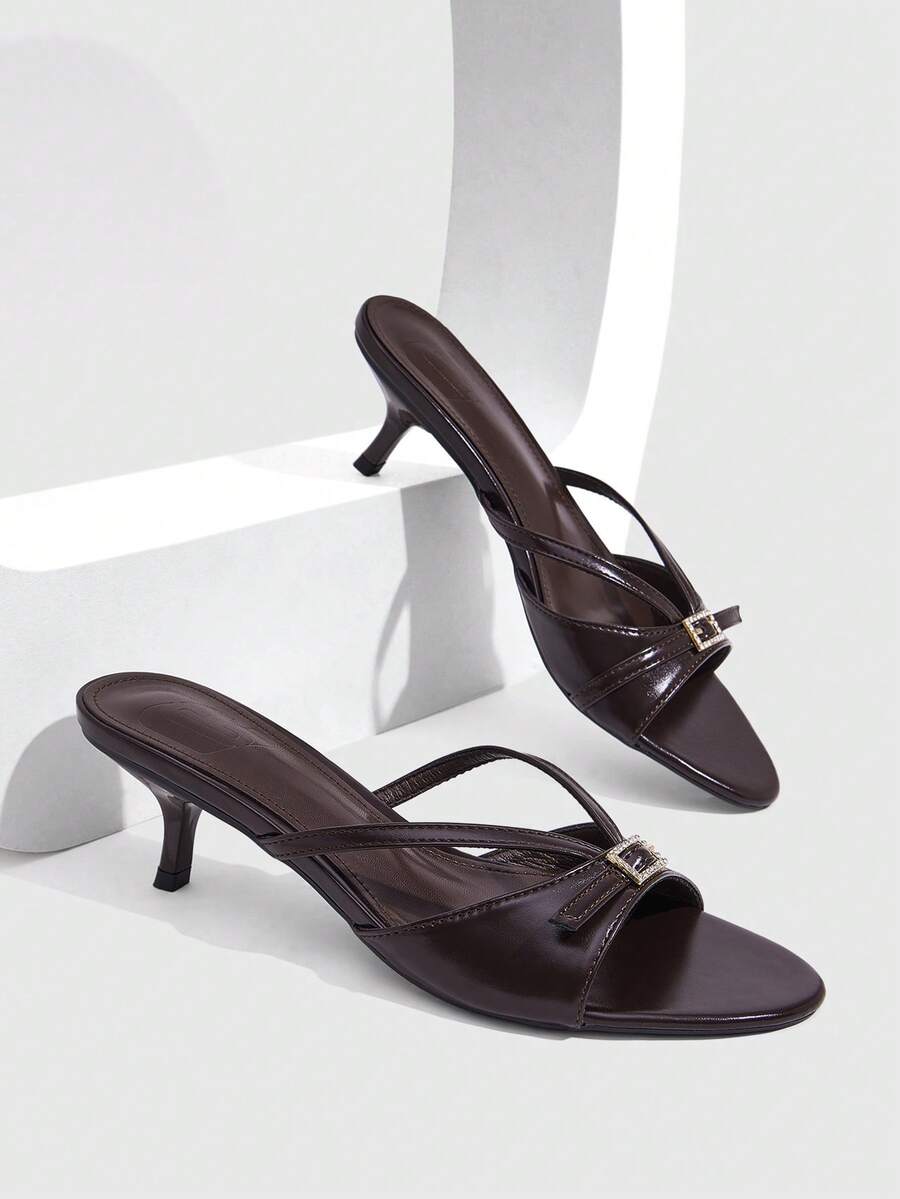 Women's light gold kitten heel slingback sandals featuring an open toe and round buckle strap.
