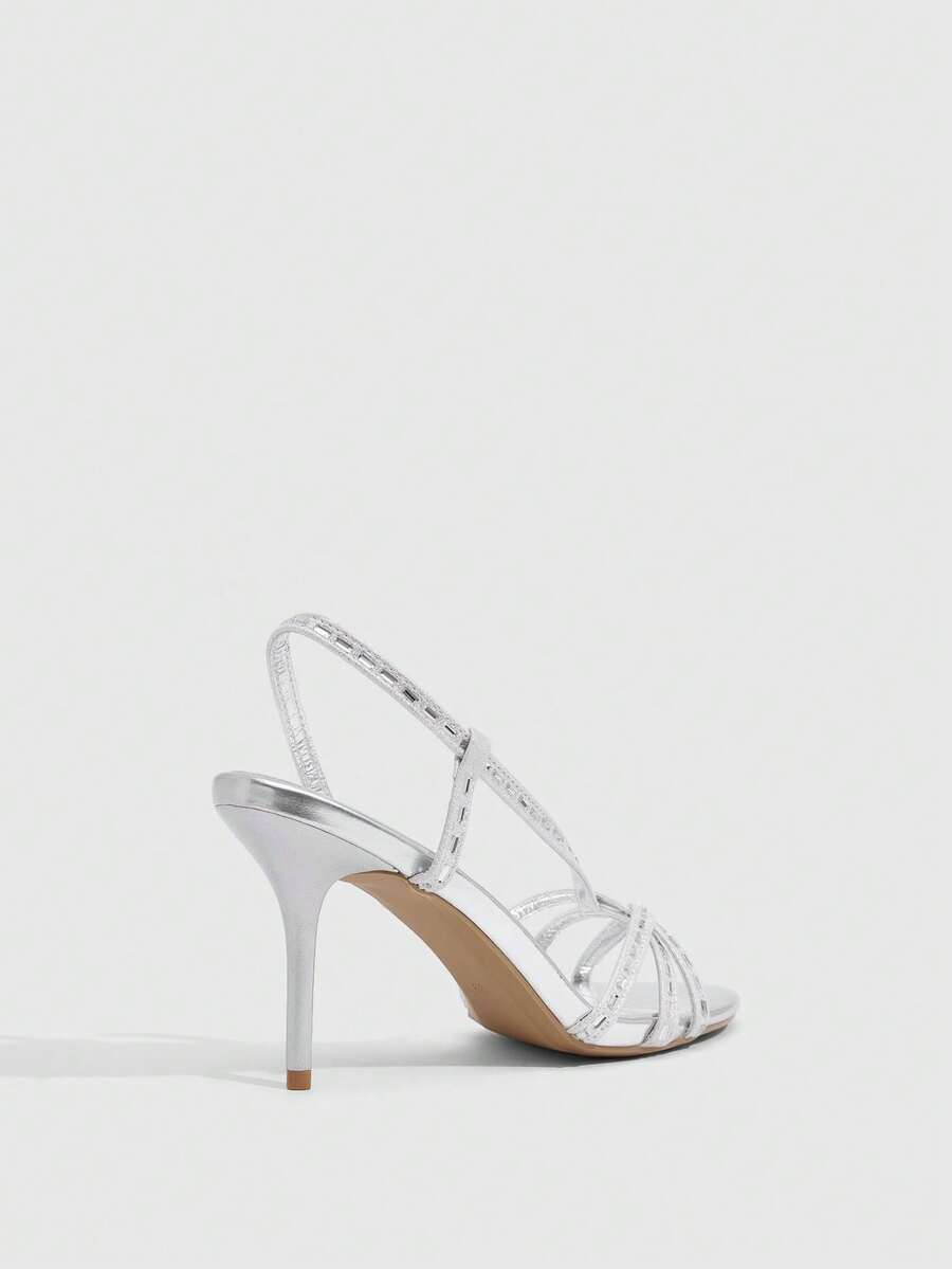 Women's open toe stiletto heel sandals featuring square toe design, criss-cross rhinestone slim straps, and secure ankle strap.
