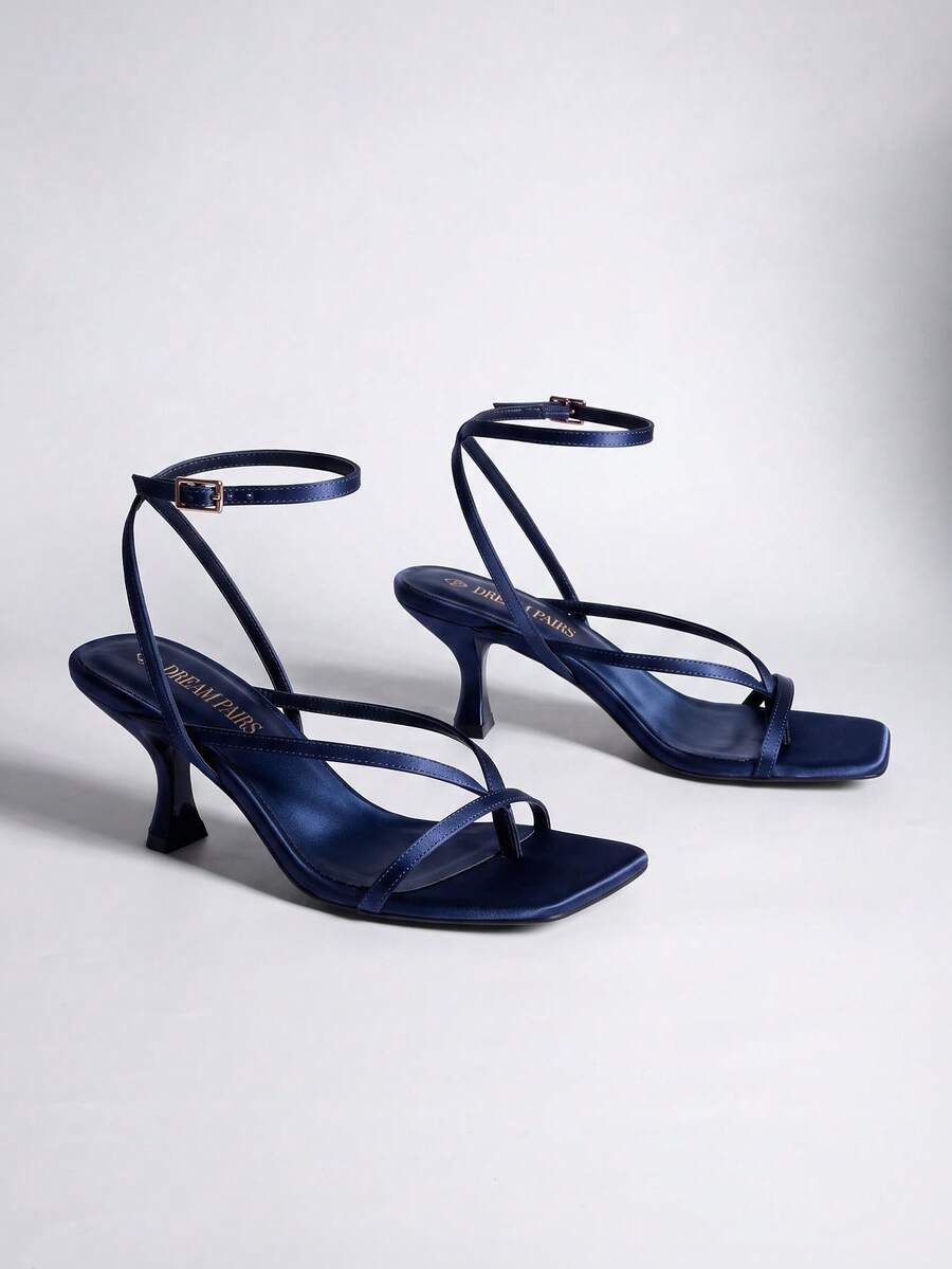 Pair of women's minimalist square toe kitten heeled thong sandals featuring slim ankle straps with buckle closure and sleek low heels.
