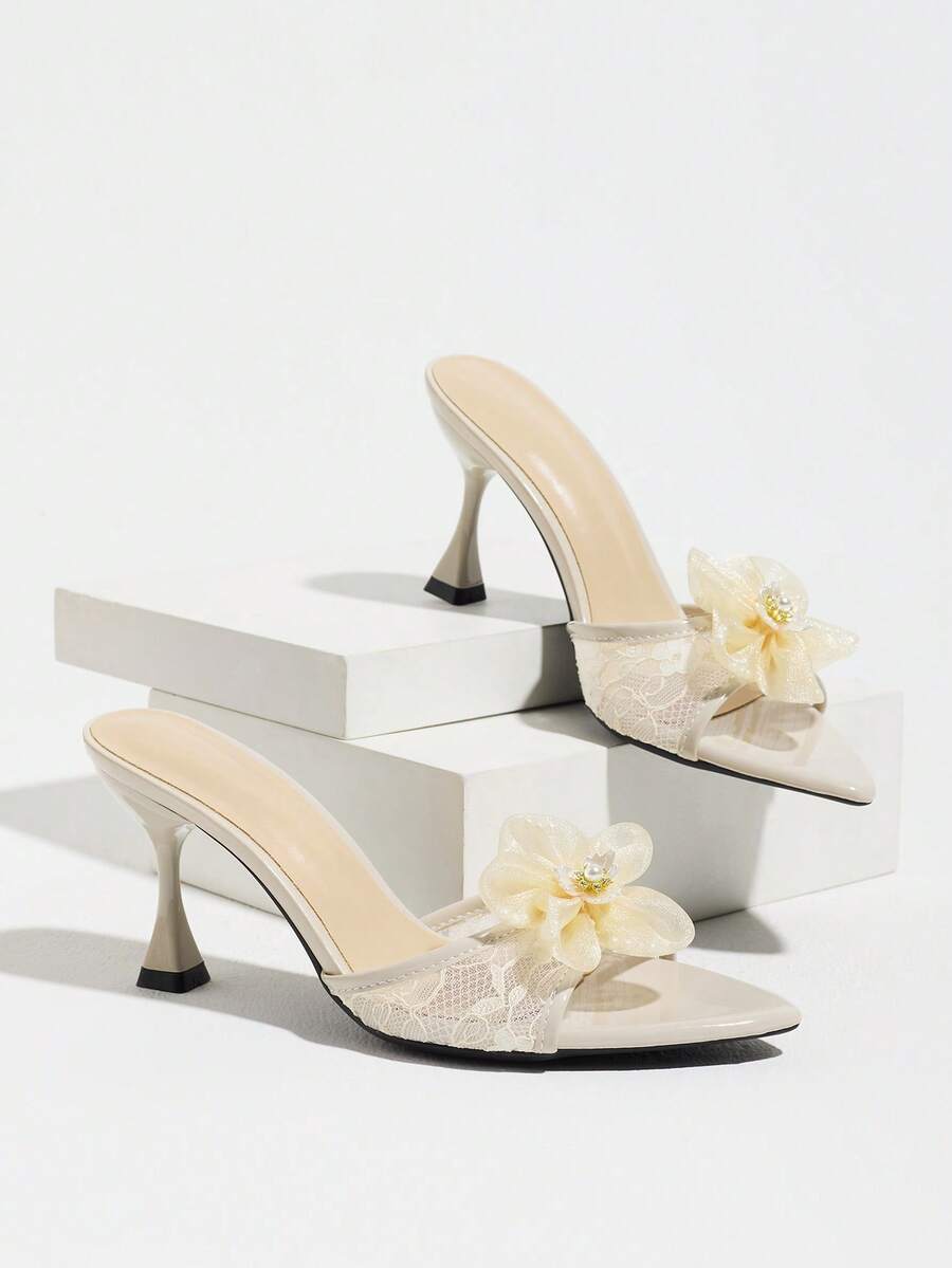 Women's pointed toe high heel mule sandals featuring a sleek slip-on design with elegant lace embroidery detailing