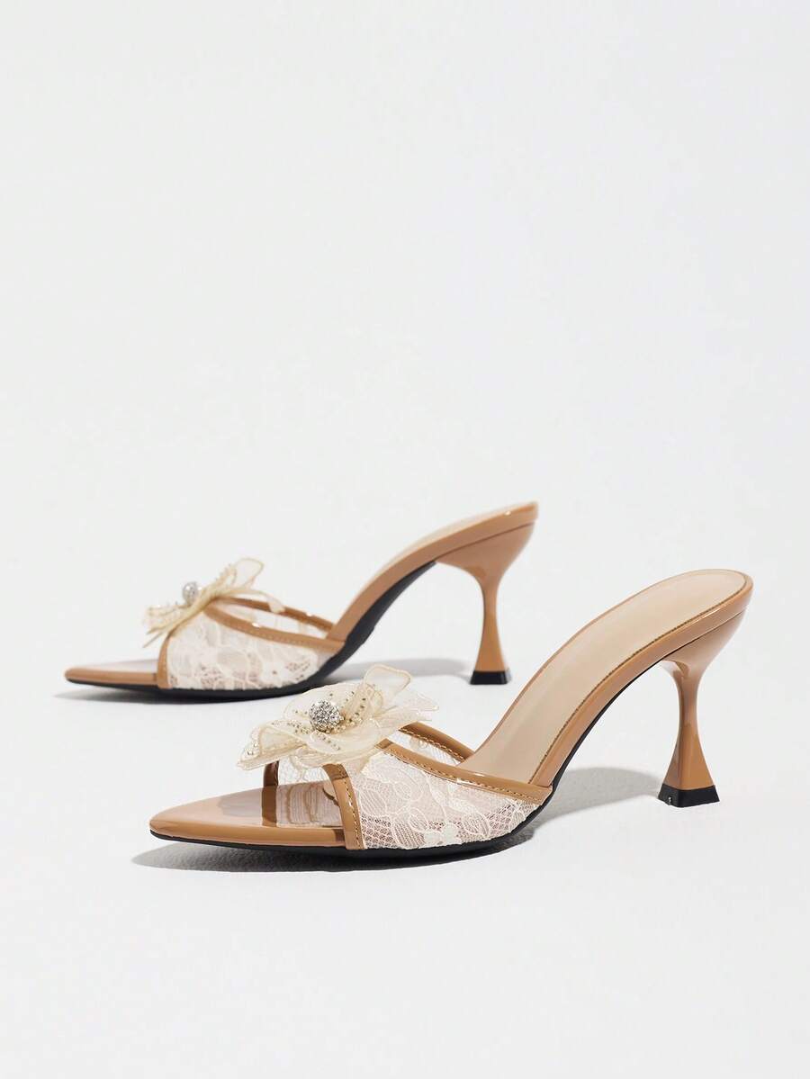 Women's pointed toe high heel mule sandals featuring a sleek slip-on design with elegant lace embroidery detailing