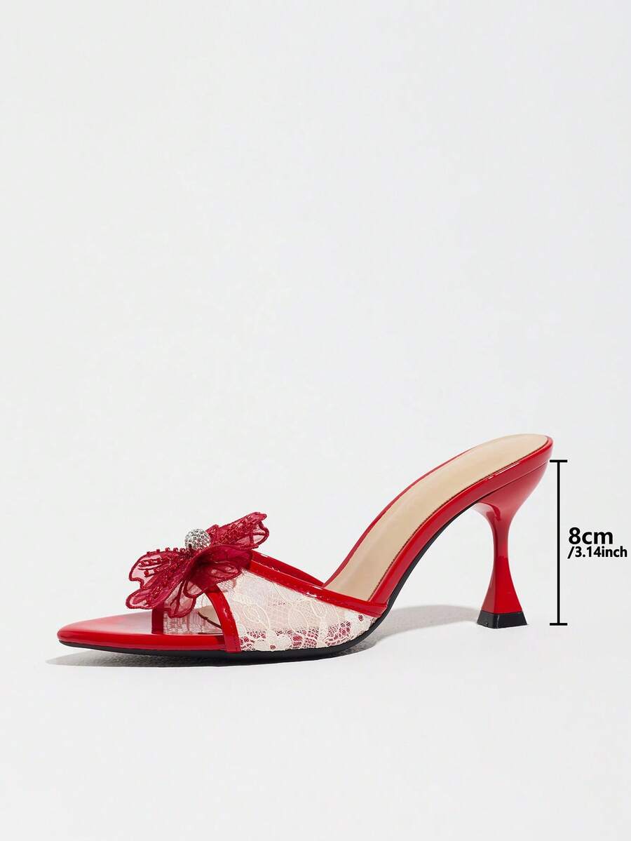 Women's pointed toe high heel mule sandals featuring a sleek slip-on design with elegant lace embroidery detailing