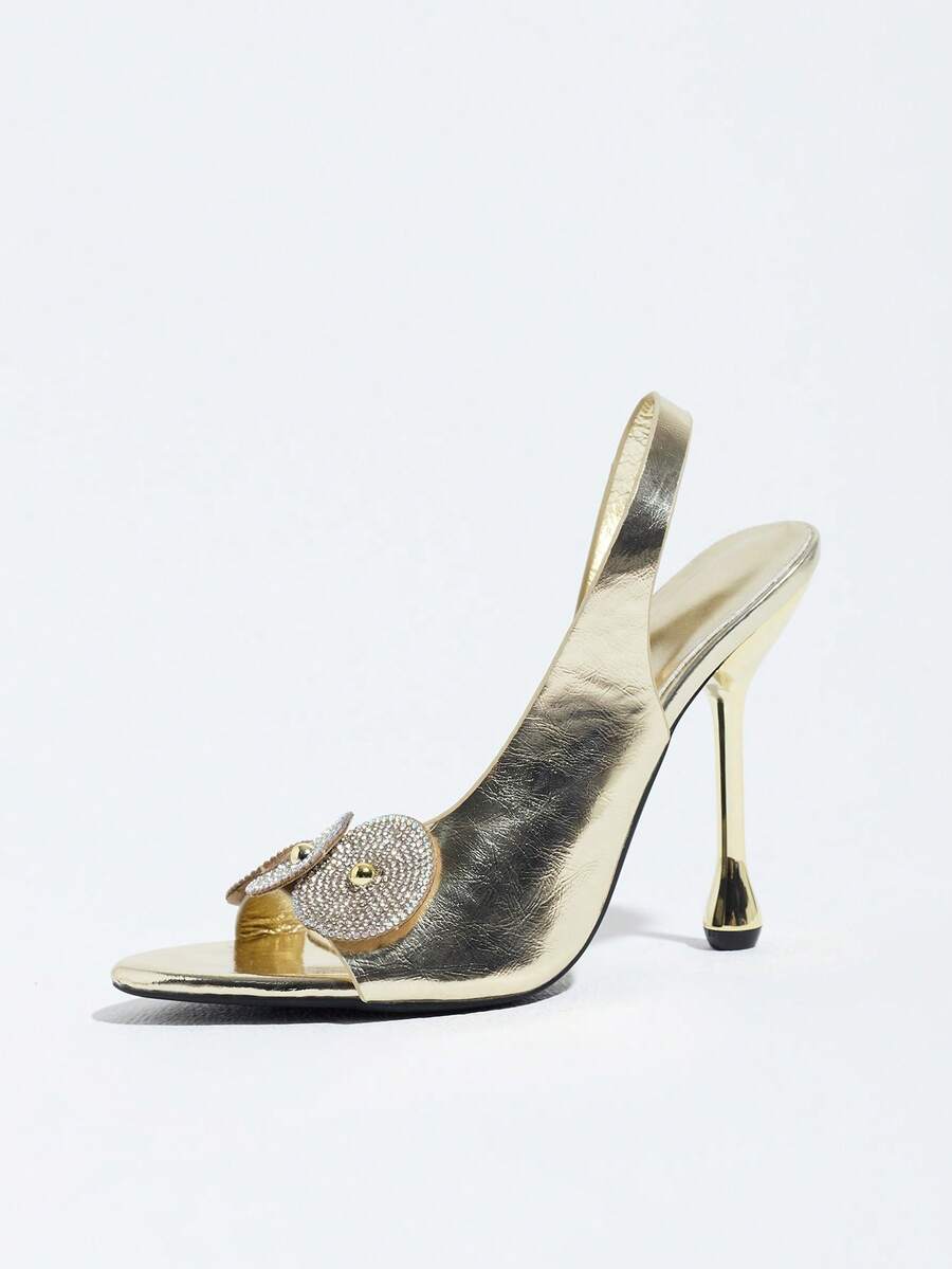 Women's stiletto high heel sandals with sparkling vine-shaped rhinestone ankle strap embellishments and open pointed toe design.