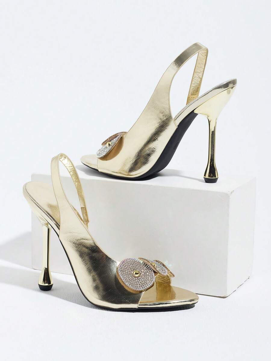 Women's stiletto high heel sandals with sparkling vine-shaped rhinestone ankle strap embellishments and open pointed toe design.