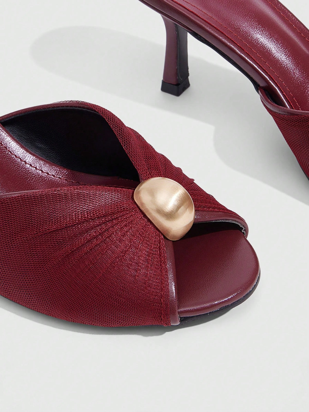 Pair of women's open toe kitten heel sandals and mules in sleek PU leather with rubber soles.