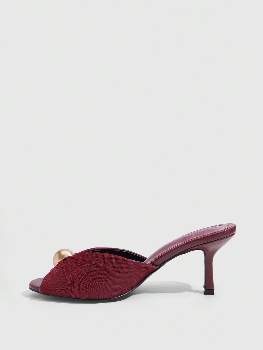Pair of women's open toe kitten heel sandals and mules in sleek PU leather with rubber soles.