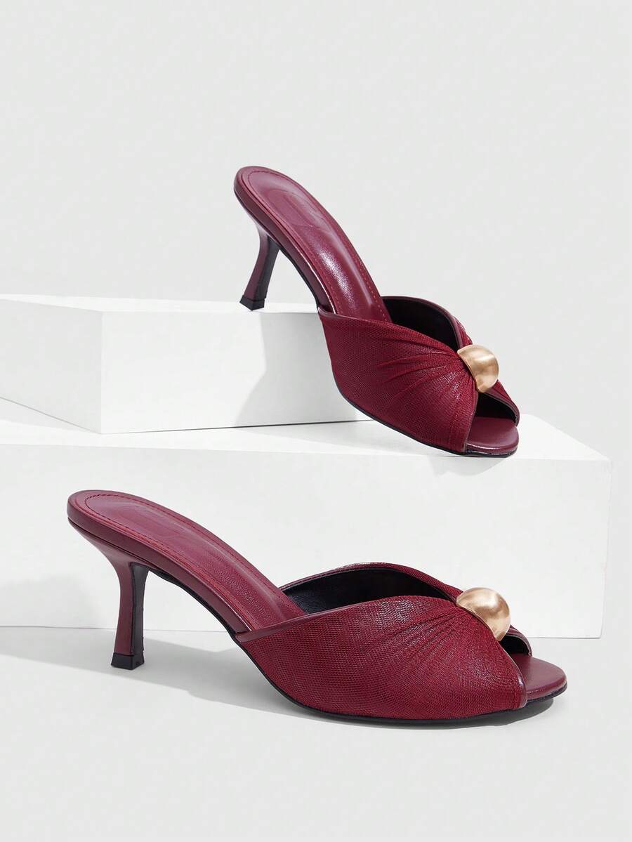Pair of women's open toe kitten heel sandals and mules in sleek PU leather with rubber soles.