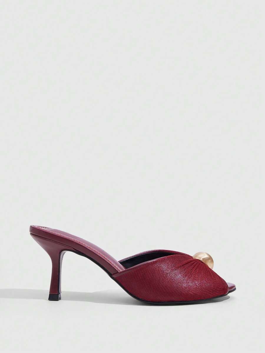 Pair of women's open toe kitten heel sandals and mules in sleek PU leather with rubber soles.