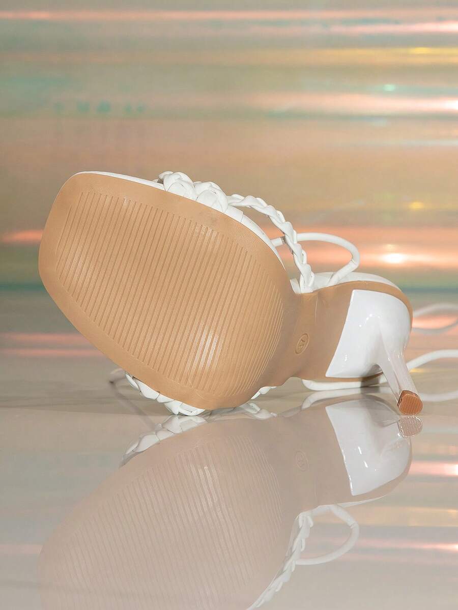 Women's stiletto high heel thong sandals featuring a T-strap toe loop design and ankle buckle strap