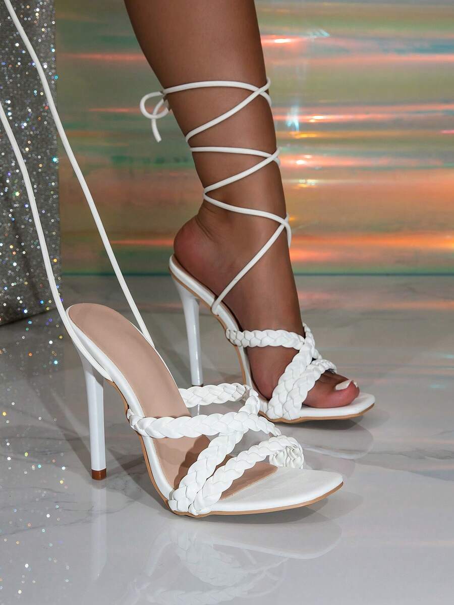 Women's stiletto high heel thong sandals featuring a T-strap toe loop design and ankle buckle strap