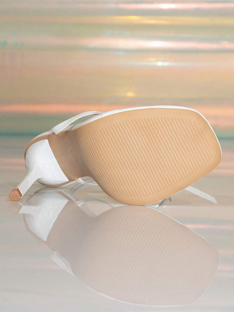 Women's stiletto high heel thong sandals featuring a T-strap toe loop design and ankle buckle strap