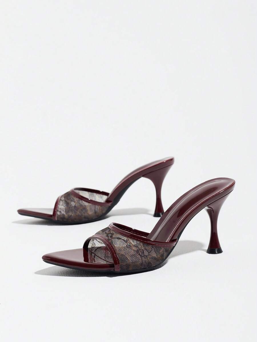 Women's open pointed toe stiletto mule high heel sandals featuring a glossy slip-on design.